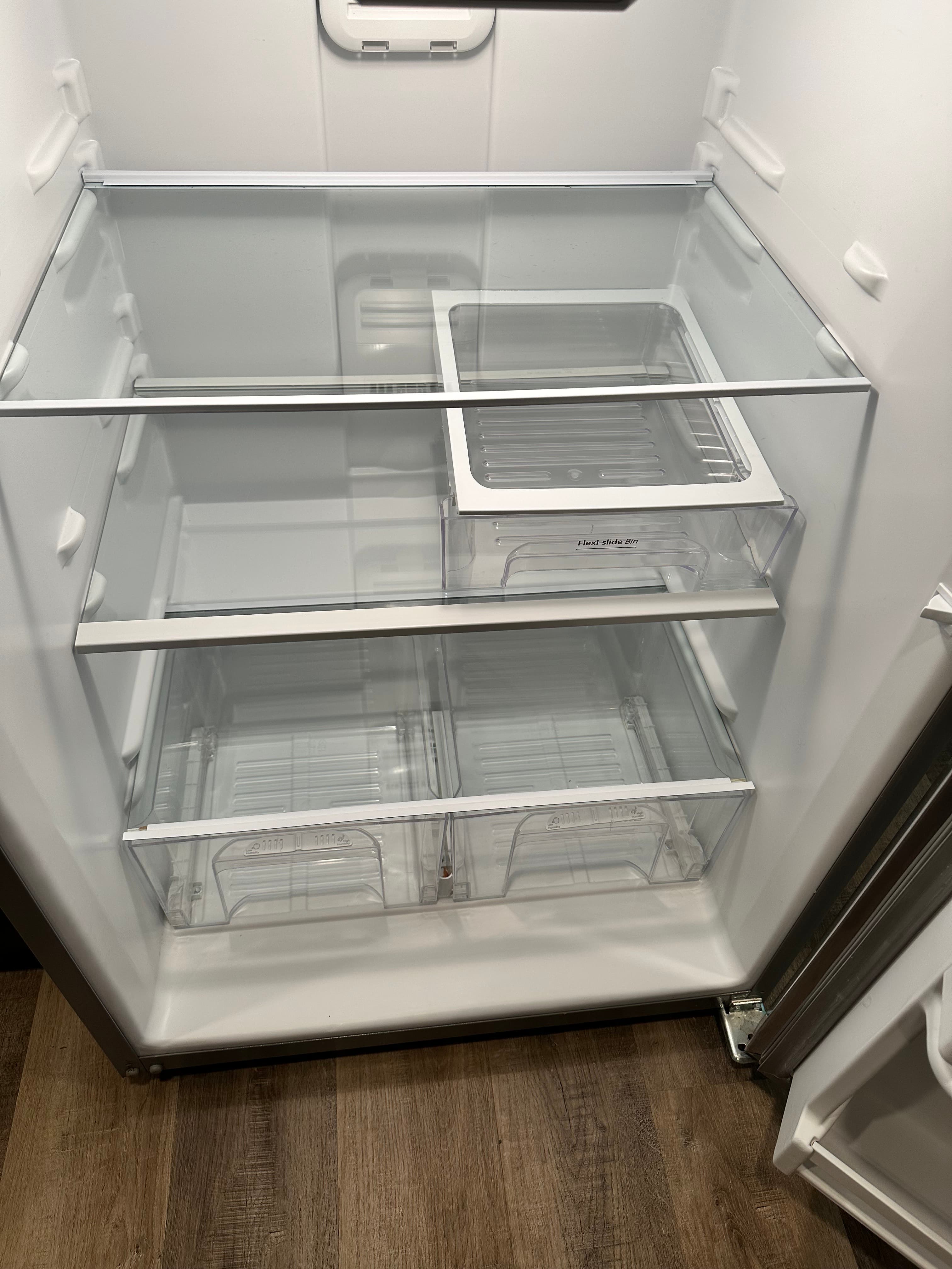 Spotless refrigerator interior after move-out cleaning